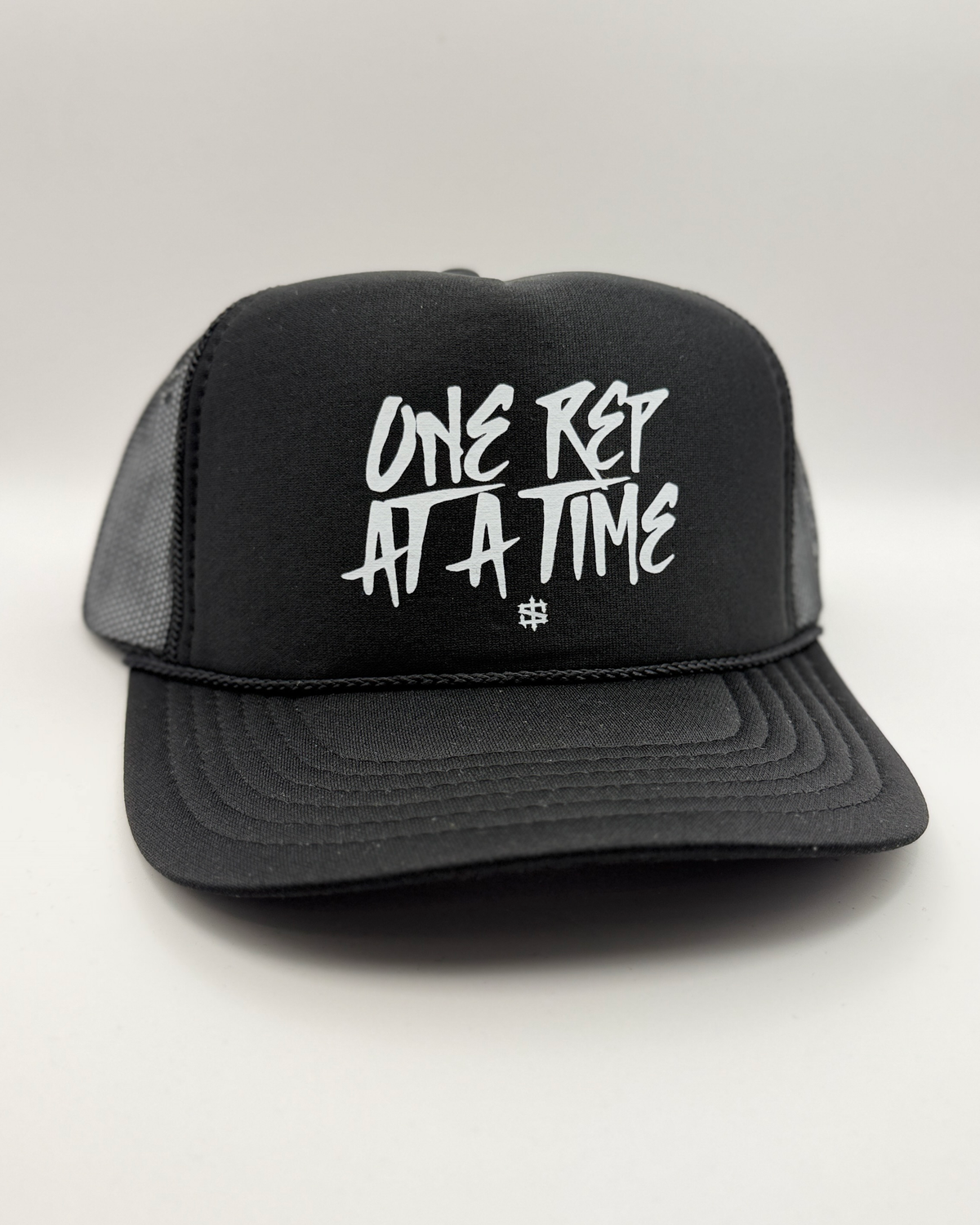 One Rep at a Time Trucker Hat - Black, front view